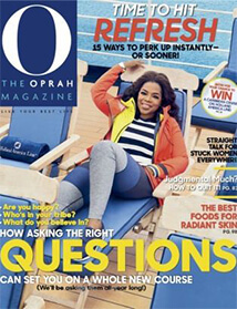 Cover of O Magazine with Oprah lounging in chair.